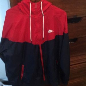 A varsity red navy blue and white nike windbreaker